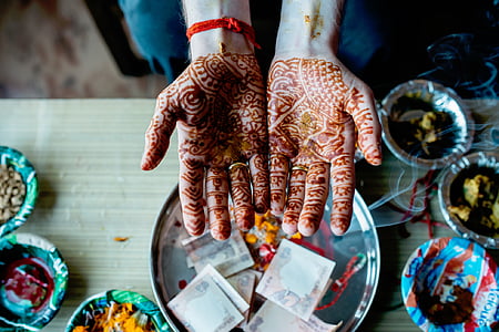 person having mehindi tattoo thumbnail