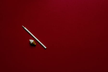 stylus on red surface thumbnail