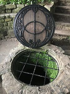 opened round black and gray manhole thumbnail