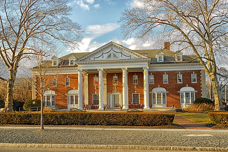 landscape photo of brown brick house thumbnail
