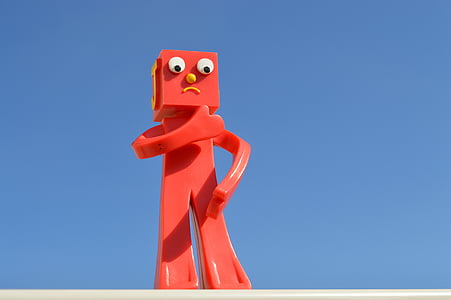 red character toy against blue background thumbnail