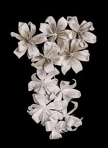 white artificial flower on black surface thumbnail