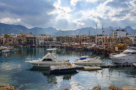 fishing vessels on dock during daytime thumbnail