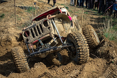 red 4 x 4 truck doing off road event thumbnail