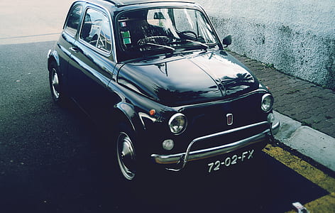 classic black car parked on road thumbnail