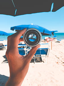 Person Holding Gray Lens thumbnail