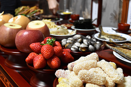 strawberries on table beside dishes thumbnail