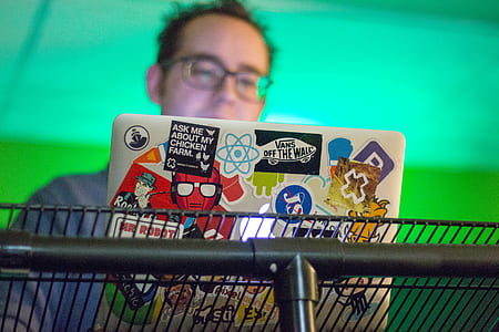 ask me about my chicken farm sticker on silver MacBook on gray metal grill thumbnail
