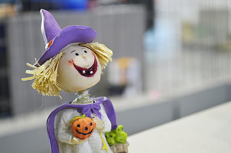 selective focus photography of witch bobblehead thumbnail