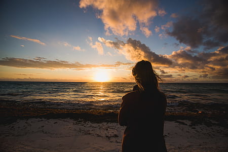 Woman Watching Beach Sunrise Photo thumbnail