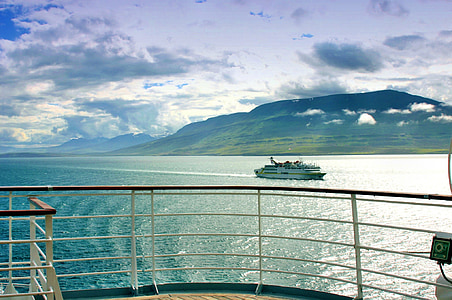 white ship with mountain background thumbnail