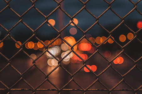 macro photo of grey metal cyclone fence thumbnail