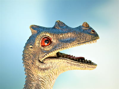 dinosaur against blue background thumbnail