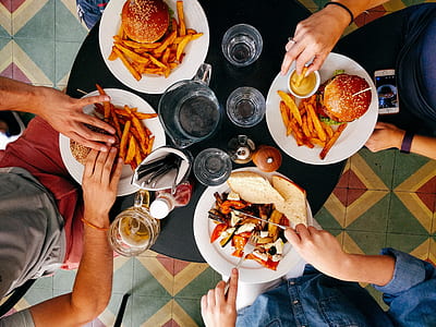 four meals on white plates thumbnail