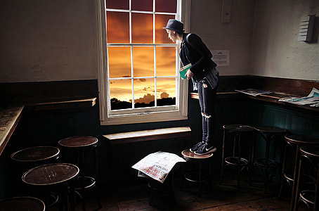 person standing near window thumbnail