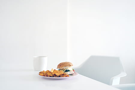 white ceramic mug near plate with dish thumbnail