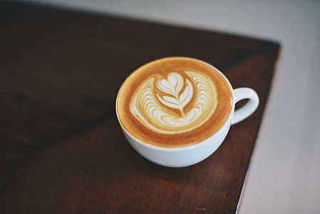 cup of latte on table thumbnail