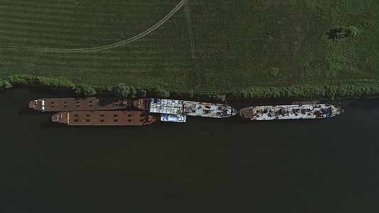 aerial photography of four boats thumbnail