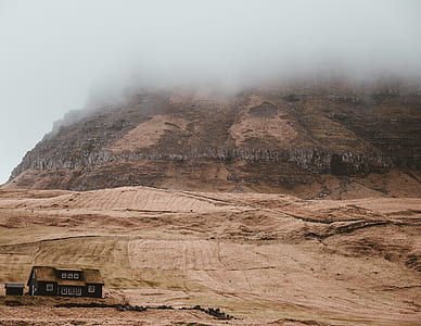 house on desert during daytime thumbnail