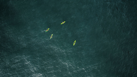 aerial photography of four boats thumbnail