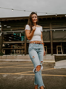 woman wearing white off-shoulder top while being photograph thumbnail
