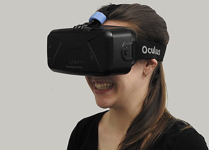 smiling woman wearing black Oculus virtual reality headset thumbnail