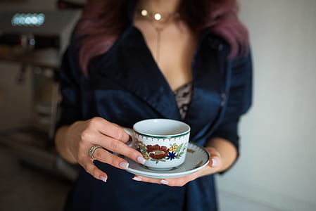 person holding teacup thumbnail