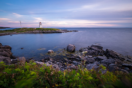 landscape photo of sea near lighthouse thumbnail