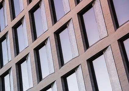 low angle photo of gray framed glass-panel building thumbnail