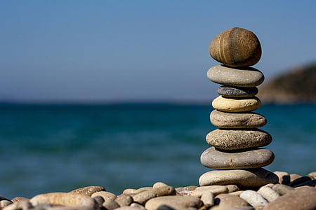 stack of stones near body of water thumbnail