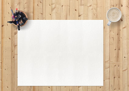 white blank paper below pen organizer beside cup of coffee thumbnail