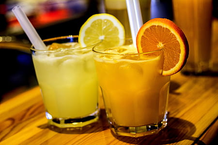 citrus and orange juice inside rock glasses thumbnail
