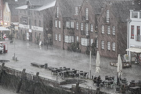 building beside body of water during rainy day thumbnail