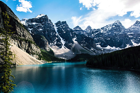 photo of mountains near body of water thumbnail