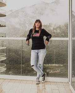 woman standing in front of glass fence thumbnail