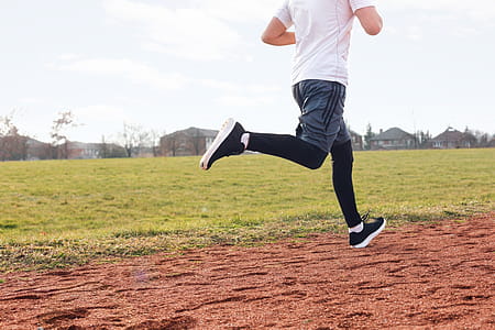 Man Running At The Track Photo thumbnail
