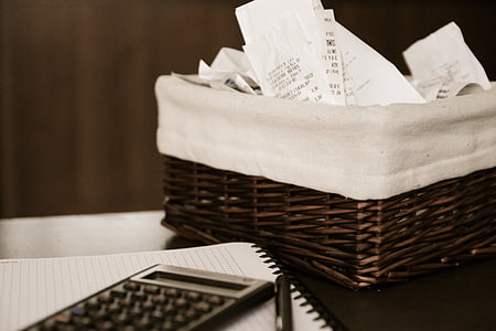 brown wicker basket near black scientific calculator thumbnail