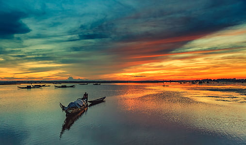 landscape photography of body of water during sunset thumbnail