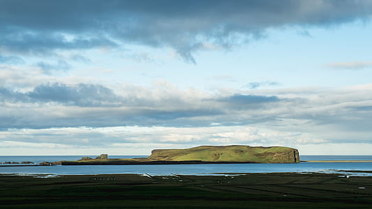 island on body of water at daytime thumbnail