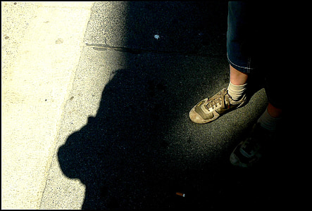 person standing on pavement thumbnail