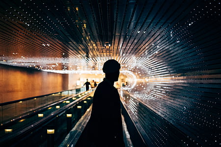 silhouette photo of standing man inside building thumbnail