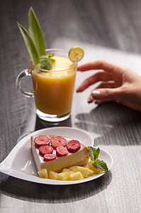 flat lay photography of sandwich and juice on tabletop thumbnail