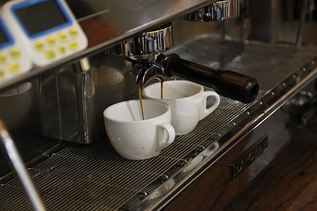 two white mugs on brew machine thumbnail