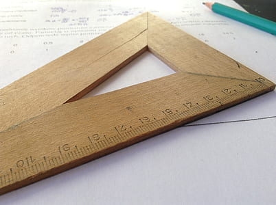brown wooden ruler on white printer paper thumbnail