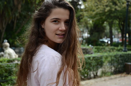 woman looking side near green tree thumbnail