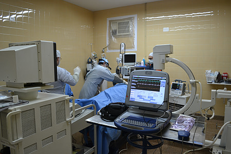white medical equipment on brown wooden table thumbnail