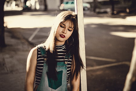woman leaning on bar and closing her eyes thumbnail