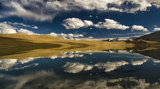mountain ranges under cloudy sky thumbnail