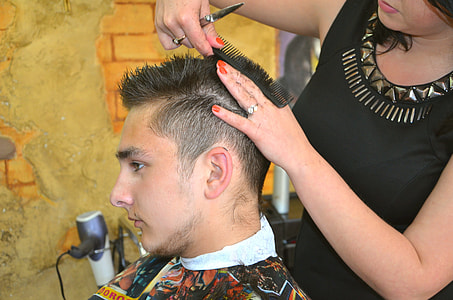 woman cutting man's hair thumbnail