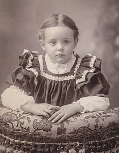 grayscale photo of girl wearing dress thumbnail